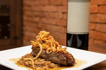 Argentine Chorizo steak, with risotto and caramelized fried onion