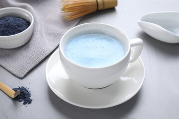 Obraz na płótnie Canvas Blue matcha latte in cup on grey table