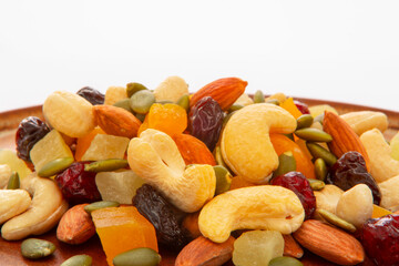 The plate contains nutritious mixed nuts