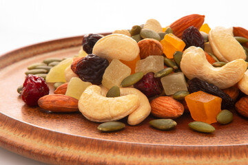 The plate contains nutritious mixed nuts