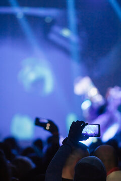 audience with mobile phones,performance,blue