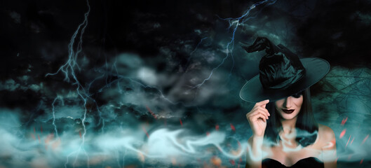 Fototapeta na wymiar Young girl dressed as witch in misty forest on stormy night. Halloween fantasy