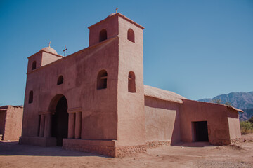 Fototapeta premium Pink Church. Adobe Road, in Catamarca, Argentina