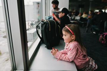 young girl traveling on a plane