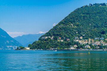Fototapeta premium Beautiful view of Lake Como, Italy with fountain, boats, and towns