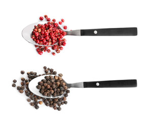 Spoons with red and black peppercorns on white background, top view