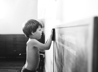 boy erases chalkboard