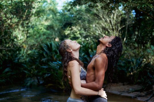 Couple practicing Tantra Yoga in the river