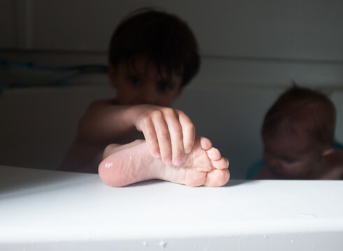 closeup of child's foot in bathtub