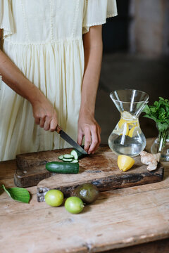 Female making natural vitamin drink