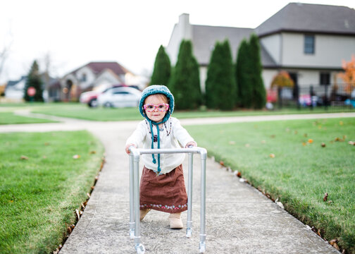 Toddler Girl Dresses Up As Old Lady With Walker For Halloween