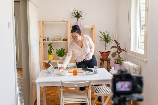 Young woman vlogging about homemade face mask