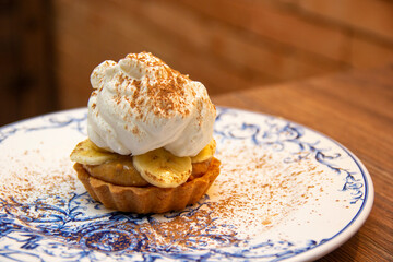 Banoffee Pie. Traditional English dessert prepared with banana and dulce de leche or caramel