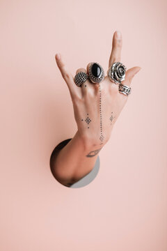 Hand Of A Young Woman Doing Rock Sign