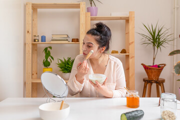 Young woman making a homemade face mask