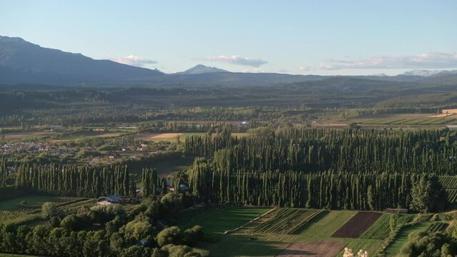 Tilt up shot revealing the rural area of El Bolson, located between Andes and Piltriquitron mountain