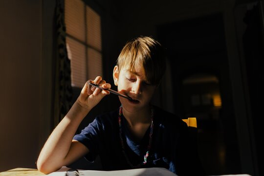young boy doing homework