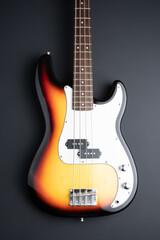Plakat Electric bass guitar isolated on a black background