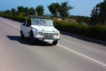 car on the road through the streets of formentera in summer