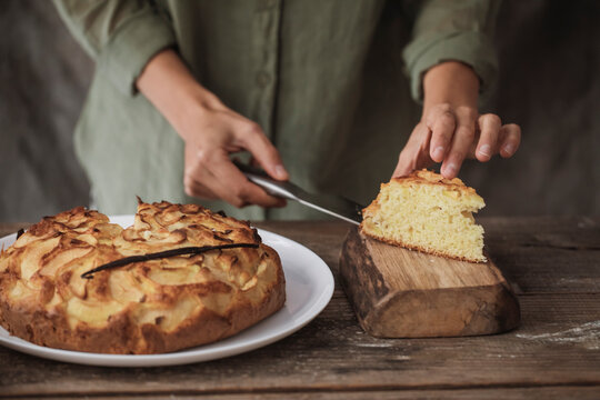 Woman Cutting A Pie