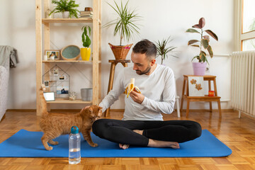 Young man doing yoga at home