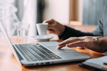 Senior businessman working at the coffee shop