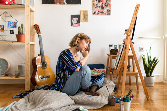 Young girl painter at home