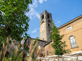 Fototapeta na wymiar Bergamo, Italy. The old town. Landscape at the clock tower called Il Campanone. It is located in the main square of the upper town. Bergamo one of the most beautiful in Italy