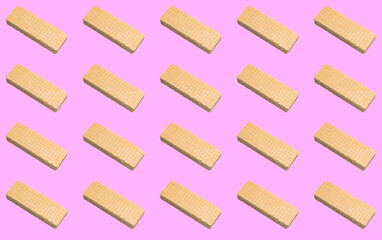 Pattern with waffles on a pink background.