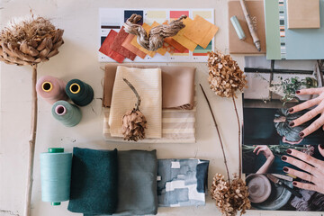 Anonymous Hands Selecting Pictures For Moodboard