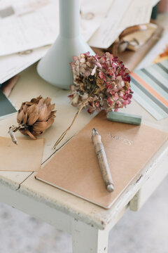 Natural Notebook On Wooden Table With Dry Flowers