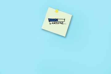 paper note on blue background with message LOADING