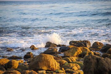 ocean waves rolling in at the beach crashing into the rocks at El Matador beach in Malibu California