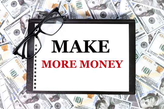 make more money. text on white paper on money background