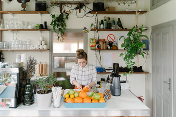 Young woman working at coffee bar