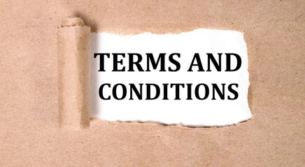 terms and conditions text on white backing on torn paper