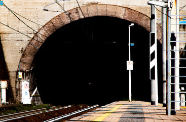 rails of the train entering a tunnel