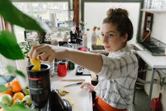 Young woman working at coffee bar