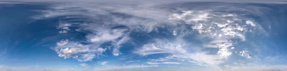 Seamless blue evening sky hdri panorama 360 degrees angle view with zenith and beautiful clouds for use in 3d graphics as sky dome or edit drone shot