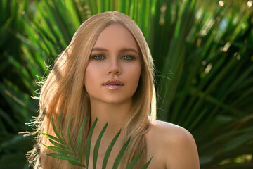 Beautiful young blonde woman with perfect skin and long light blond hair