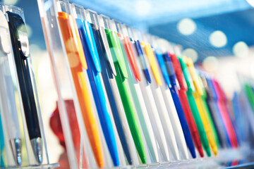 Colored plastic pens on store display