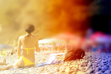 Photo of a beautiful girl in a swimsuit on the beach