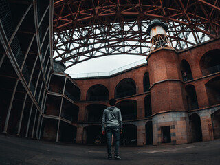 Man walking into a urban ruins in california