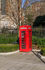 A traditional red phone booth in London.