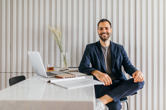 Young interior designer working from home