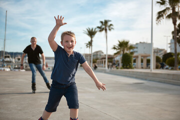 Father and son with roller skates