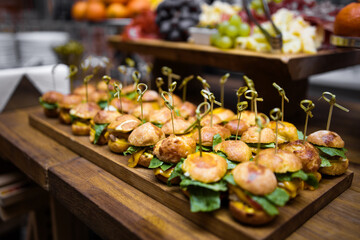 hamburgers and grilled vegetables on a grill