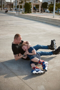 Father and son with roller skates
