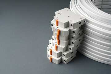 Home electric background with circuit breakers and cable. Copy space.