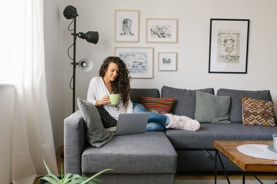 Woman working from home on the sofa